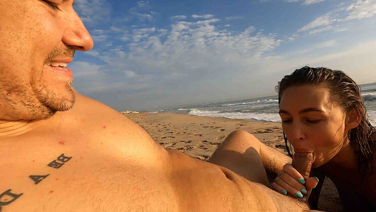 Amelia Drops to Her Knees for a Public Beach Blowjob